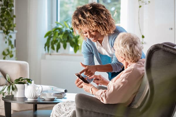 Caregiver supporting an older adult at home